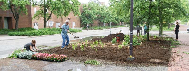 Planting flower beds in front of the Crop Science building