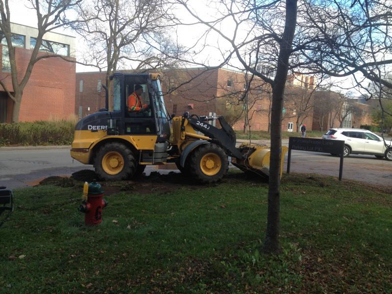 Tractor on grass in front of the Crop Science building