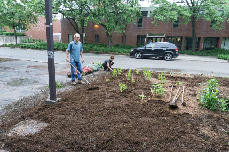 Planting flower beds in front of the Crop Science building