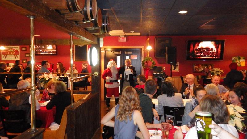 Clarence and Santa speaking at the party