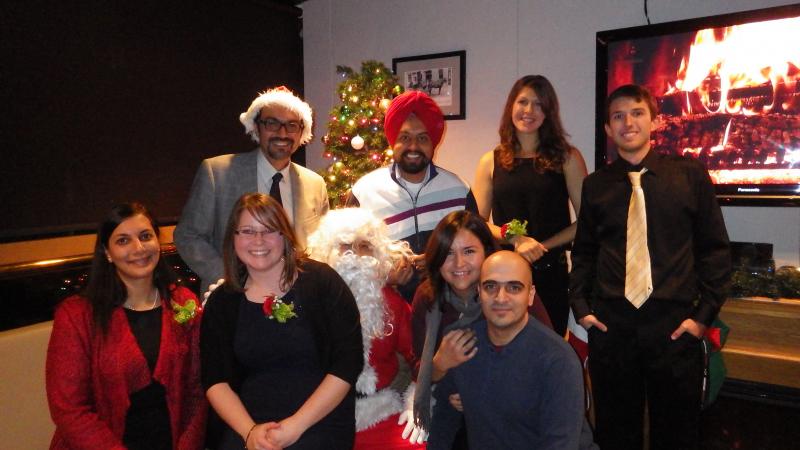 Faculty and staff with Santa