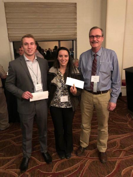 Brendan Metzger and Brittany Hedges receiving the 2nd best graduate student paper presentation award 