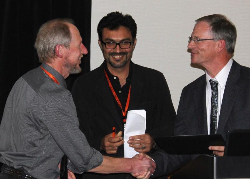 Peter Pauls receives his award from Phil Miklas (President Bean Improvement Cooperative) 