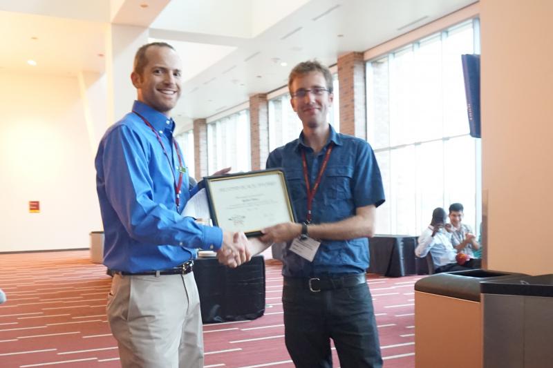 Rob receiving his award from the Chair of the Organizing Committee, Dr. Bob Stupar of the University of Minnesota