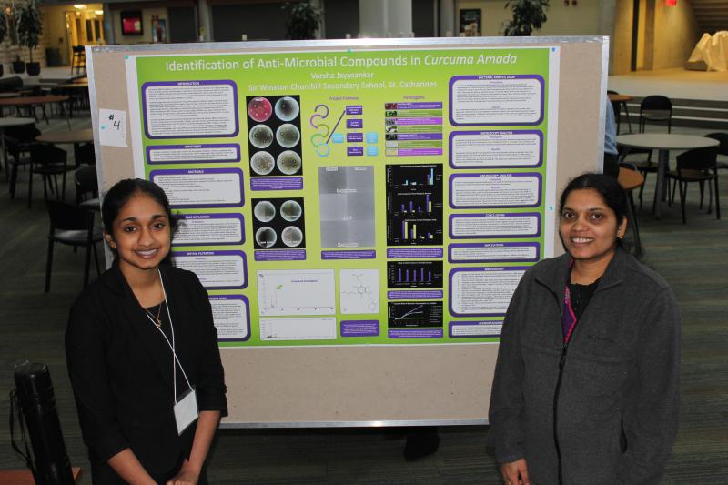 Grad Students with poster titled: " Identification of Anit-Microbial Compounds in Curcuma Amada"