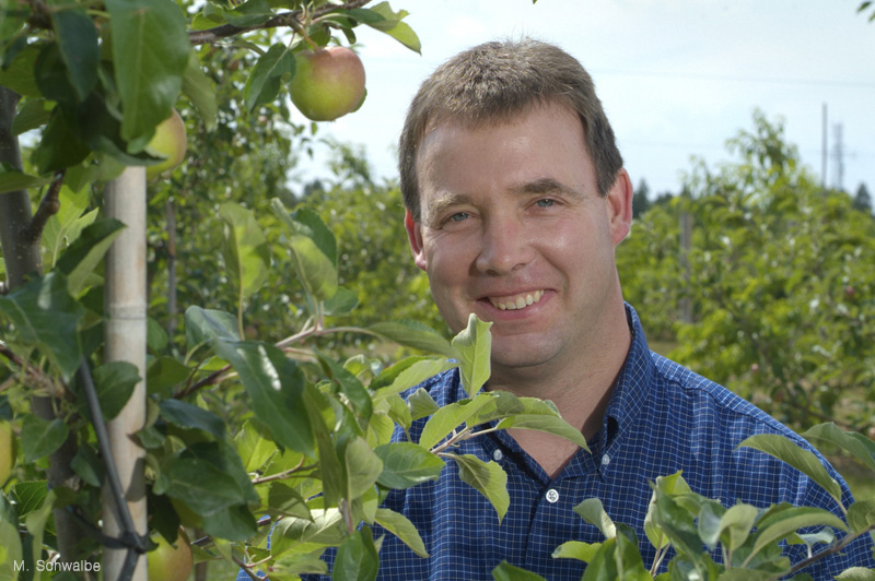 John Cline in orchard