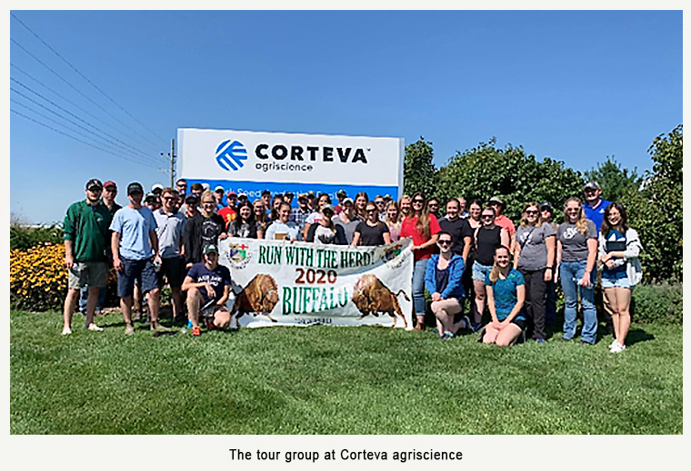 The tour group in front of Corteva agriscience sign