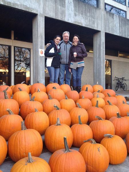 Clarence, Amelie and Maryam sell pumpkins outside the crop science building