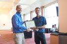 Rob receiving his award from the Chair of the Organizing Committee, Dr. Bob Stupar of the University of Minnesota