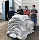 Guelph Food Bank volunteers receiving 800kg of beans grown by the dry bean breeding program