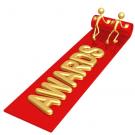Red carpet with word 'Awards' in gold lettering