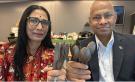 Drs. Manju Misra and Amar Mohanty holding compostable cutlery