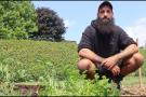 Marco Pepe kneeling in garden