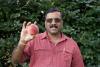 Dr. Subramanian holding a peach.
